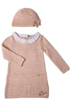 Clothes for children. A beautiful pink baby girl dress with white lace collar and long sleeves isolated on a white background. Clipping path. Kids autumn and spring fashion.