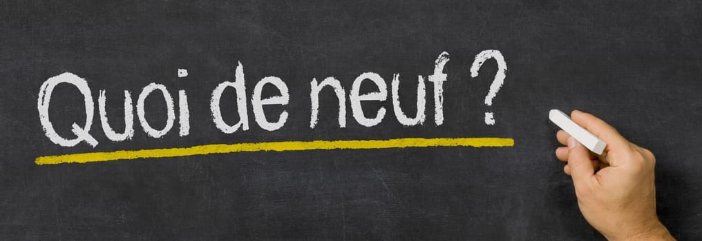 Text written on a blackboard - What's new in french - Quoi de neuf