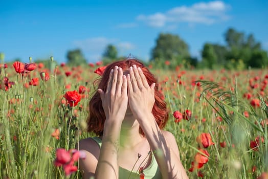 girl with red hairs covers her eyes