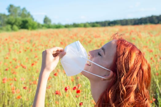 girl taking off protection mask