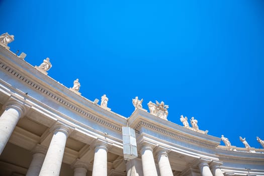 Rome, Vatican State. Details of columns of Saint Peter Square with copyspace on blue