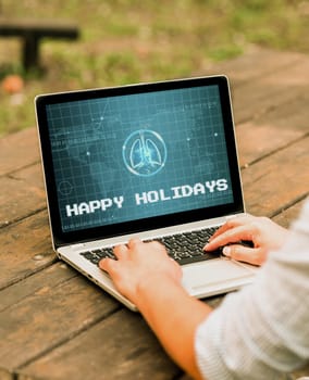 Hand writing sign Happy Holidays, Business showcase Made a short journey by a group of showing for pleasure Laptop Placed Resting On Table Working In The Park Doing Remote Jobs.