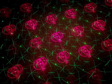 A beautiful shot of laser lights with star and firework shapes on the wall.