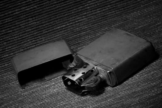 Gasoline vintage lighter close up, still life, black and white