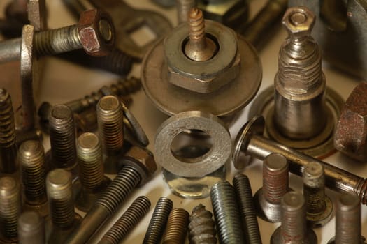 pile of bolts, screws and nuts, metalwork fixture -up