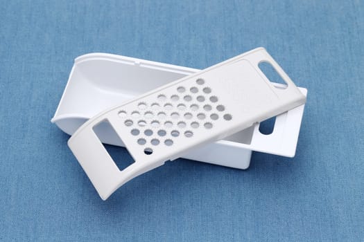 vegetable cutter and slicer with metal blades on a table