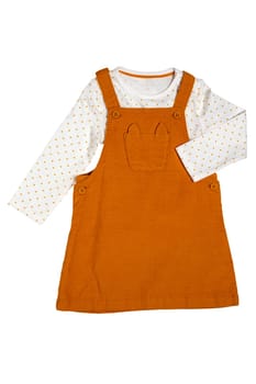 Summer dress isolated. Closeup of a beautiful orange baby girl dress and a white shirt with yellow polka dots isolated on a white background. Children spring fashion.