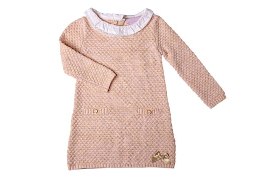 Clothes for children. A beautiful pink baby girl dress with white lace collar and long sleeves isolated on a white background. Clipping path. Kids autumn and spring fashion.