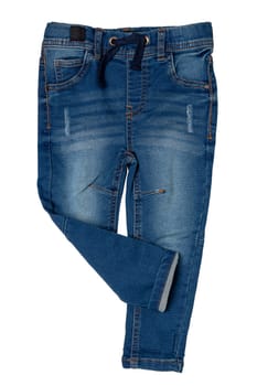 Blue jeans isolated. Closeup of a trendy stylish dark blue denim pants or trousers for boys isolated on a white background. Kids summer and autumn fashion. Front view.
