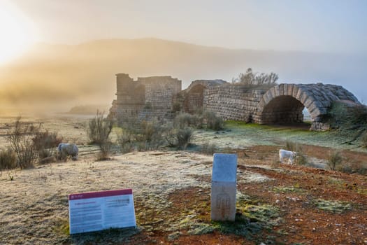 Alconetar Bridge remanis a fog winter rising, Caceres, Spain. Segmental arch bridge designed by Apollodorus of Damascus