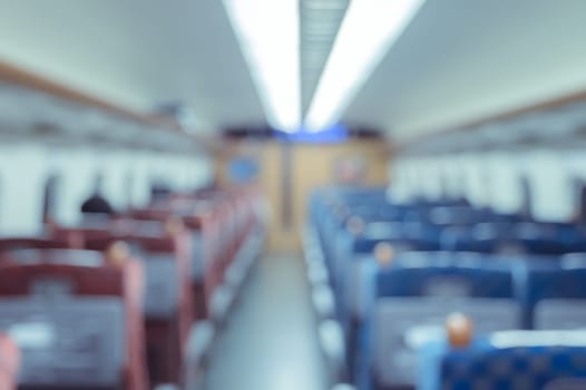 Abstract blurred Interior of a passenger car background. Travel concept with public train transport.