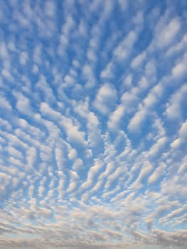 Abstract cloudscape scene. Beautiful sky background with fluffy clouds texture. Marvelous aerial composition, overcast shapes and patterns. Air freshness and celestial beauty