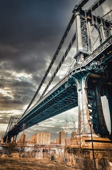 Manhattan Bridge in New York City, during a cloudy day, view from low angle left side, united states