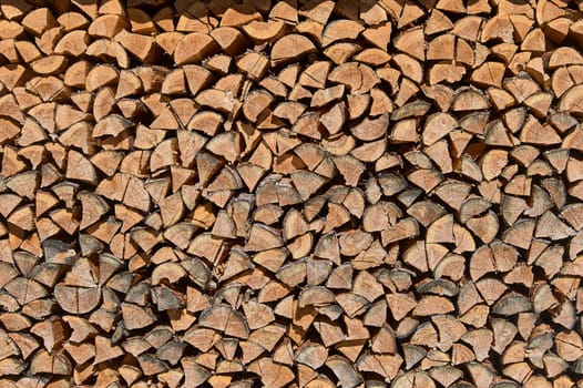 background of stacked firewood, woodpile. High quality photo