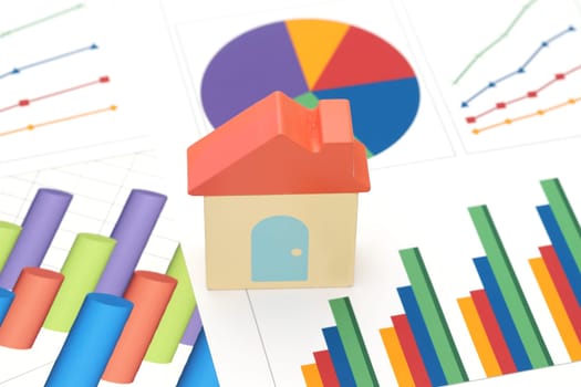 toy house and color chart printed documents on the table