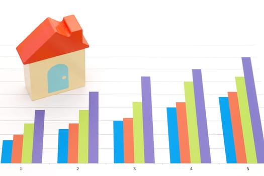 toy house and color chart printed documents on the table