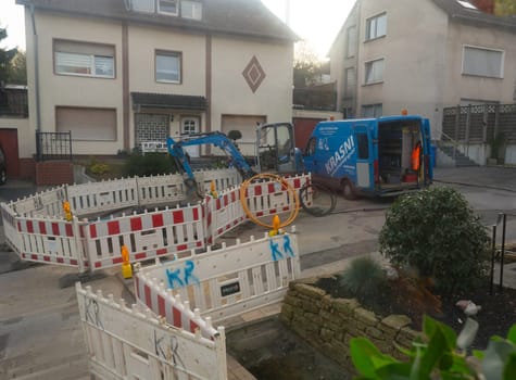 Heiligenhaus, Nrw, Germany - October 29, 2019:.Civil engineering works for the installation of gas, water and power lines for a new environmentally friendly fuel cell heating