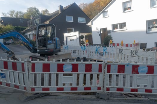 Heiligenhaus, Nrw, Germany - October 29, 2019:.Civil engineering works for the installation of gas, water and power lines for a new environmentally friendly fuel cell heating