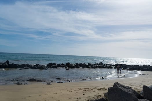 Cran Canaria, Meloneras, Spain - November 13, 2019:.People enjoy the sea view and sit in the sun on the seafront of Meloneras on Gran Canaria, Spain