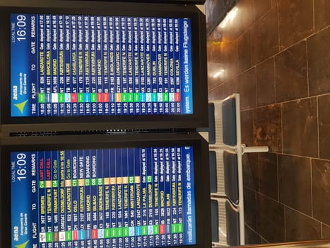 Cran Canaria, Meloneras, Spain- 17. November 2019:.Airport board at Gran Canaria airport. Realistic flip scoreboard airport template. Airport black board with alphabet and numbers. Digital airport board font on blue background. Target screen board eps