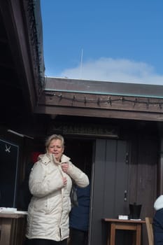 Sylt, Germany -March 13, 2020: .Woman at the Beach bar Sansibar, Kampen, Sylt, North Frisia, Schleswig-Holstein, Germany, Europe