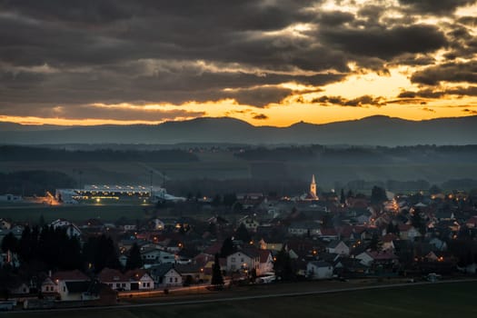 Sunset behind the Village of Ritzing Burgenland with the orange sky