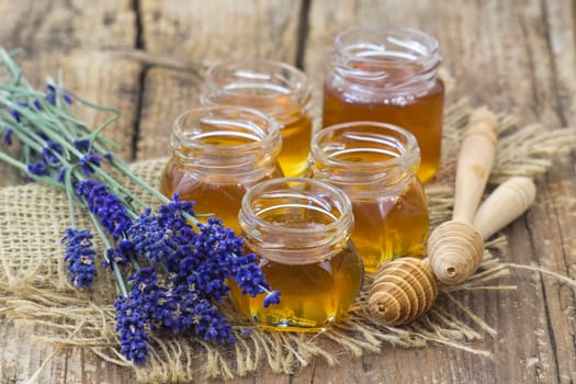 honey and lavender on wooden background
