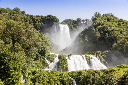 Marmore waterfall in Umbria region, Italy. Amazing cascade splashing into nature with trees and rocks.