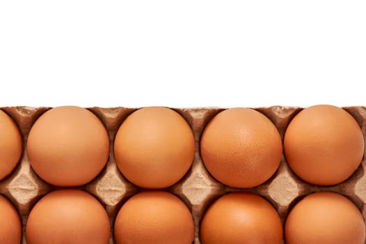 Eggs on a cardboard stand on a white insulated background. High quality photo