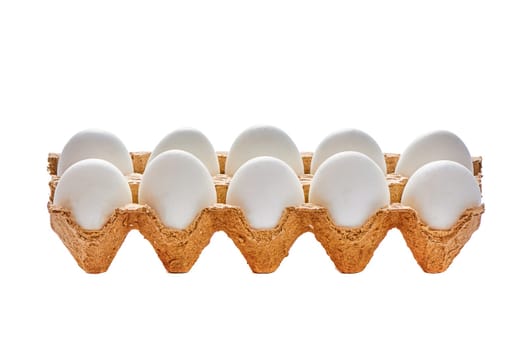 A dozen eggs on a cardboard stand on a white isolated background. High quality photo