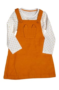 Summer dress isolated. Closeup of a beautiful orange baby girl dress and a white shirt with yellow polka dots isolated on a white background. Clipping path. Children spring fashion.