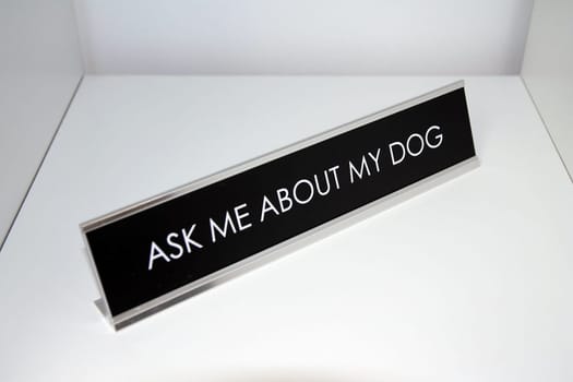 Ask me about my dog metal black and silver sign on a white shelf in office life