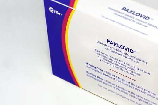 New York, USA, January 2022: Pfizer Covid-19 Paxlovid treatment box isolated on a white background. Health and prevention.