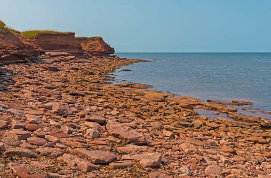 Rocky Coastline and Grassy Cliffs on The North Cape of Prince Edward Island in Canada