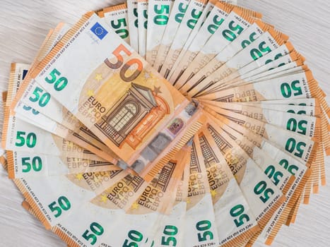 Pile of 50 euro notes, business background.