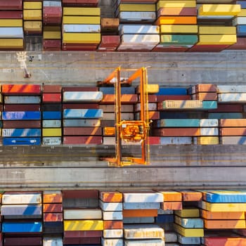 Aerial view of shipping container port terminal. Colourful pattern of containers in harbor. Maritime logistics global inport export trade transportation