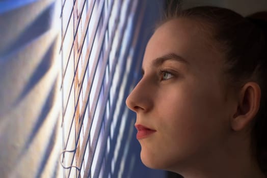 sad girl at the window