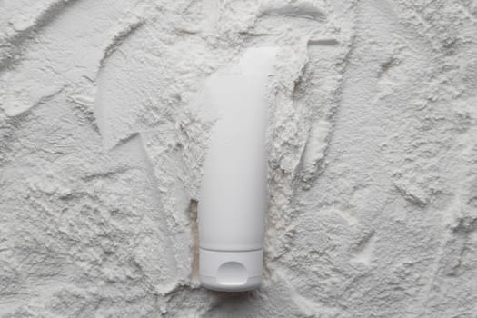 White cosmetics tube mock up on white powder background. Beauty spa medical skincare and cosmetic lotion on white decor background