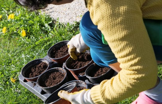 a close up of woman hands gardening