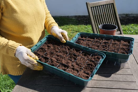 a close up of woman hands gardening