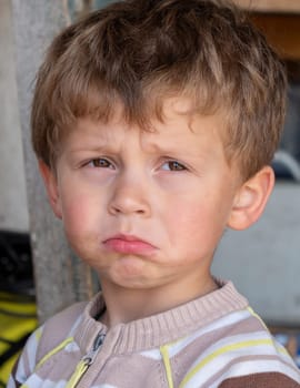 a portrait of sad young boy