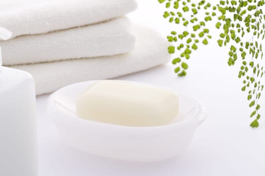 Hand-made soap and sea salt  on grey bamboo mat