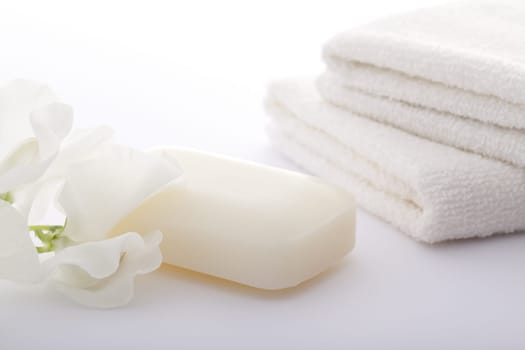 Hand-made soap and sea salt  on grey bamboo mat