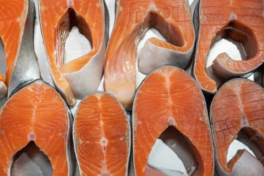 Salmon steaks fish closeup in a market. Healthy eating and fish market concept