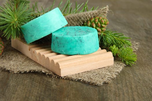 Hand-made soap and sea salt  on grey bamboo mat