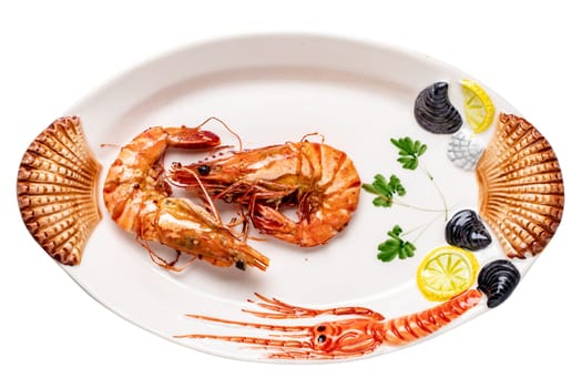 Closeup of fresh grilled large tiger prawns or shrimps on a colourful plate of seafood isolated on a white background. Healthy food concept. BBQ. Clipping path. Seafood background. Space advertising.