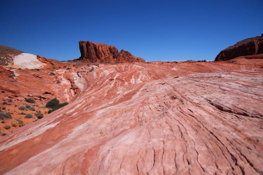 The red rocks wall at the end of the striped rock in the Valley of Fire State Park in Nevada