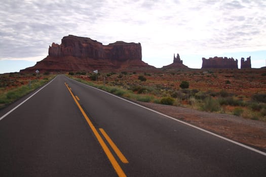 The infinite straight long old road to the Monument Valley in Utah