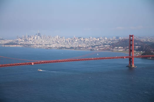 The beauty of San Francisco behind the red Golden Gate bridge in a sunny day in California
