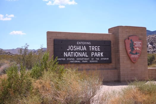 The traditional sign at the entrance of the Joshua Tree National Park in California